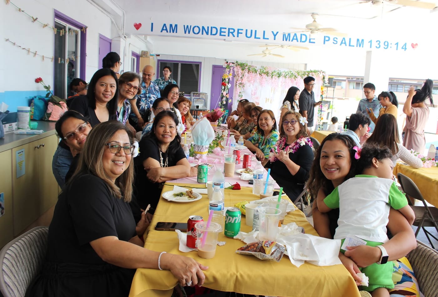 Church members serving themselves from the fellowship meal buffet