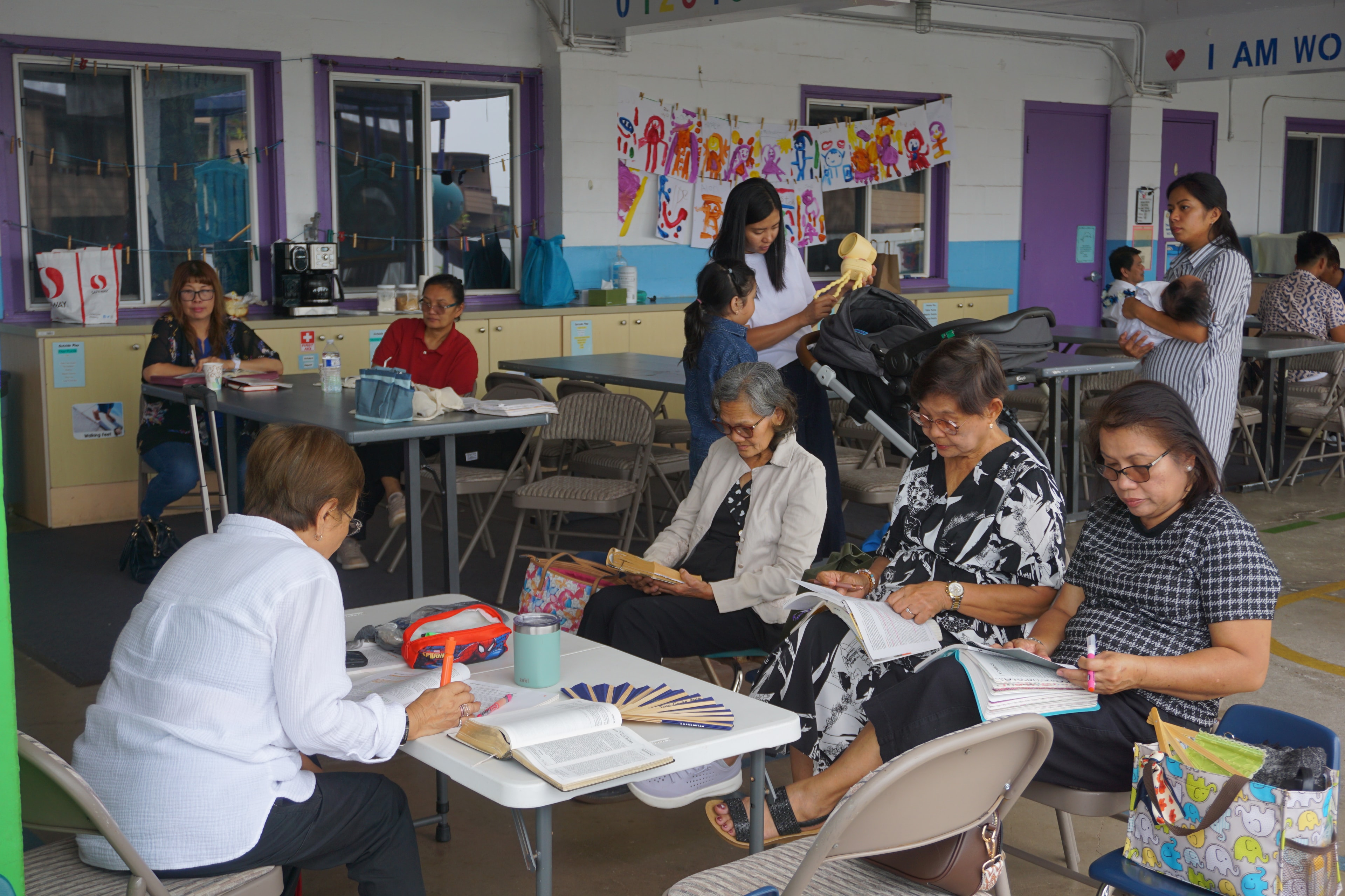 Full Sunday School room with members studying together